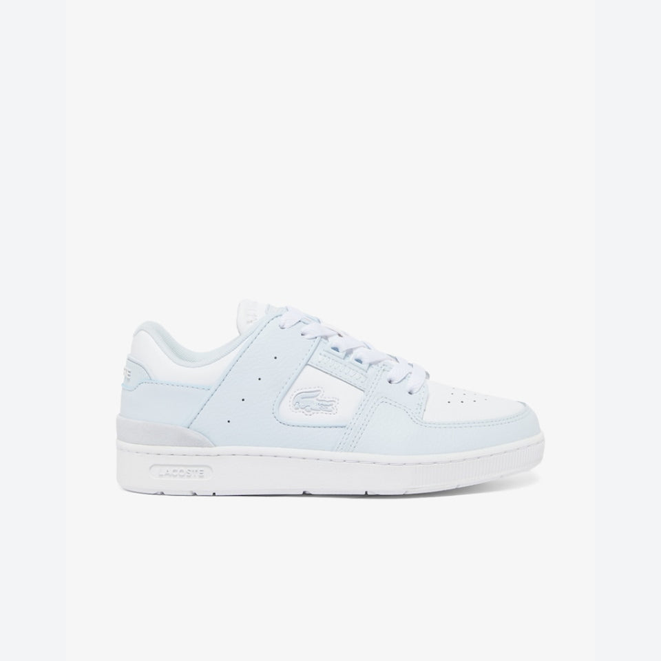 A light blue and white Lacoste low-top sneaker shown from the side profile against a clean white background.