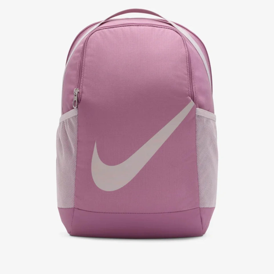 A pink Nike backpack with a large white Swoosh logo on the front, set against a plain light gray background.