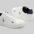 A pair of white low-top sneakers with navy blue accents and embroidered Polo Ralph Lauren logos, displayed on a light gray background.