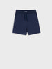 Navy blue shorts on a light gray background