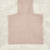 A pale blush pink ribbed knit turtleneck sweater laid flat on a white faux fur background.