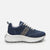 A navy blue low-top sneaker with a textured metallic silver side stripe, white laces, and a chunky white platform sole, shown from a side profile on a light gray background.