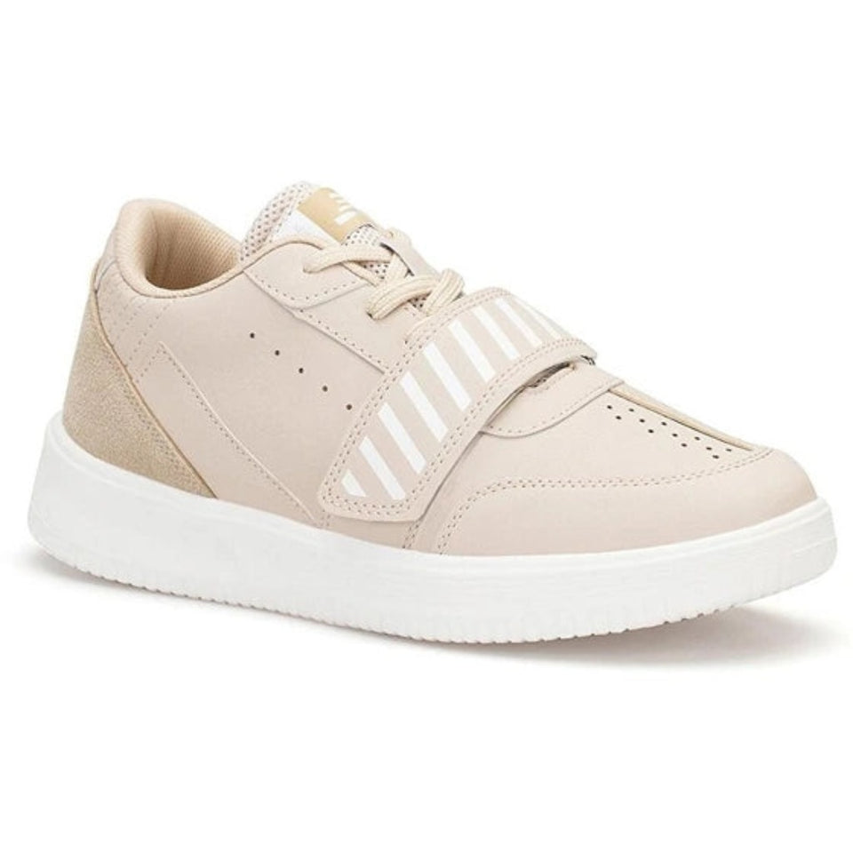 A low-top platform sneaker in light beige with white accents, featuring a hook-and-loop strap closure and a thick white platform sole, shown against a plain white background.