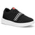 A black low-top sneaker with a thick white platform sole, featuring white diagonal stripes on the side and a red tongue label.