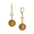 A pair of gold leverback drop earrings featuring a round white pearl and an intricate filigree gold ball dangle, shown against a plain white background.