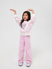 Young girl wearing a pink outfit with text on a white background