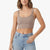 A woman wearing a ribbed scoop-neck crop top in taupe and light-wash blue jeans, shown from the waist up against a plain white background.