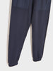 Navy blue jogger pants on a white background