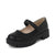 A single black faux-leather Mary Jane shoe with a chunky lug sole, shown from a three-quarters angle on a white background.