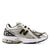 White running shoe with black and gold accents on a white background