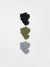 Three pairs of gloves in black, green, and gray on a white background