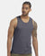 Man wearing a gray tank top on a white background