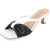 A white and black heeled mule sandal with a square toe, featuring a large black bow on the toe strap, a white slingback strap, and a low block heel. The insole displays the brand name 'JOURNEE COLLECTION'.