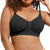 A close-up of a woman wearing a black wireless bralette with ruched cups and thin adjustable shoulder straps, shown against a plain white background.
