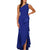 A woman modeling a royal blue one-shoulder evening gown with a beaded neckline, ruffled waist, and high-low layered skirt against a plain white background.