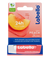 Labello peach shine lip balm packaging with peach illustration on a white background