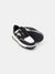 Black and white sneaker on a light gray background