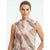 A woman wearing a sleeveless mock-neck top with a soft abstract watercolor pattern in dusty pink, beige, and taupe tones, set against a clean white studio background.