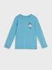 Blue long-sleeve shirt with a graphic on a light gray background