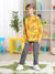 Child wearing a yellow sweatshirt with gaming console graphics in a room with colorful furniture and toys.