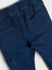 Close-up of blue jeans with a white background