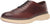 Brown leather shoe with beige sole on a white background