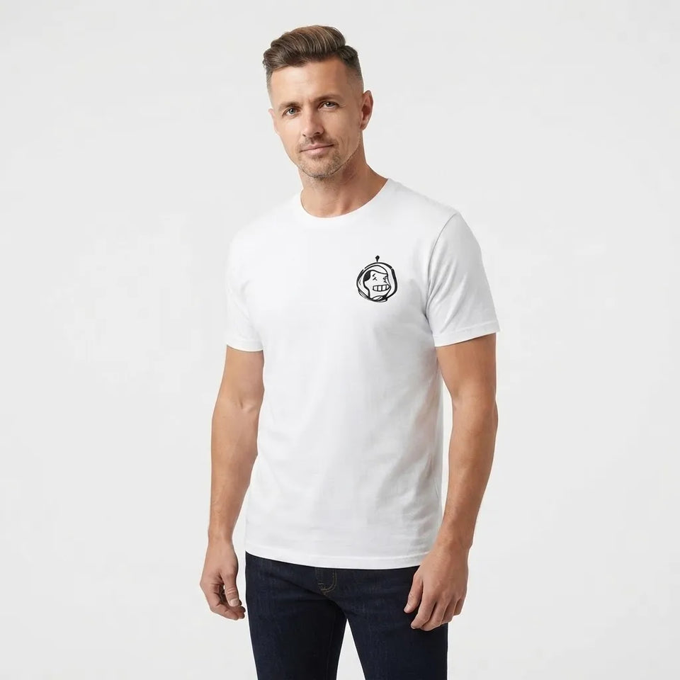 A man wearing a white short-sleeve crewneck t-shirt with a small black circular graphic on the left chest, paired with dark blue jeans, photographed against a light gray studio background.