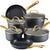 Set of black cookware with gold handles on a white background