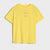 A bright yellow short-sleeve t-shirt with a small orange and white graphic on the left chest, displayed flat against a light gray background.