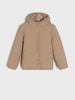 Beige puffer jacket with a hood on a light gray background
