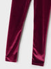 Maroon velvet pants on a white background