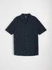 Dark blue short-sleeve shirt on a light gray background