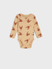 Beige baby onesie with red crab pattern on a white background
