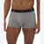 A close-up of a male model wearing Gap men's boxer briefs in heather gray with a black elastic waistband featuring the white GAP logo.
