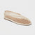 A single women's flat shoe with a beige open-knit mesh upper, beige trim, and a light brown sole, shown on a light gray background.