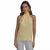 A woman modeling a pale yellow sheer halter-neck blouse with a large bow tie detail at the collar, paired with light gray pants, against a plain white background.