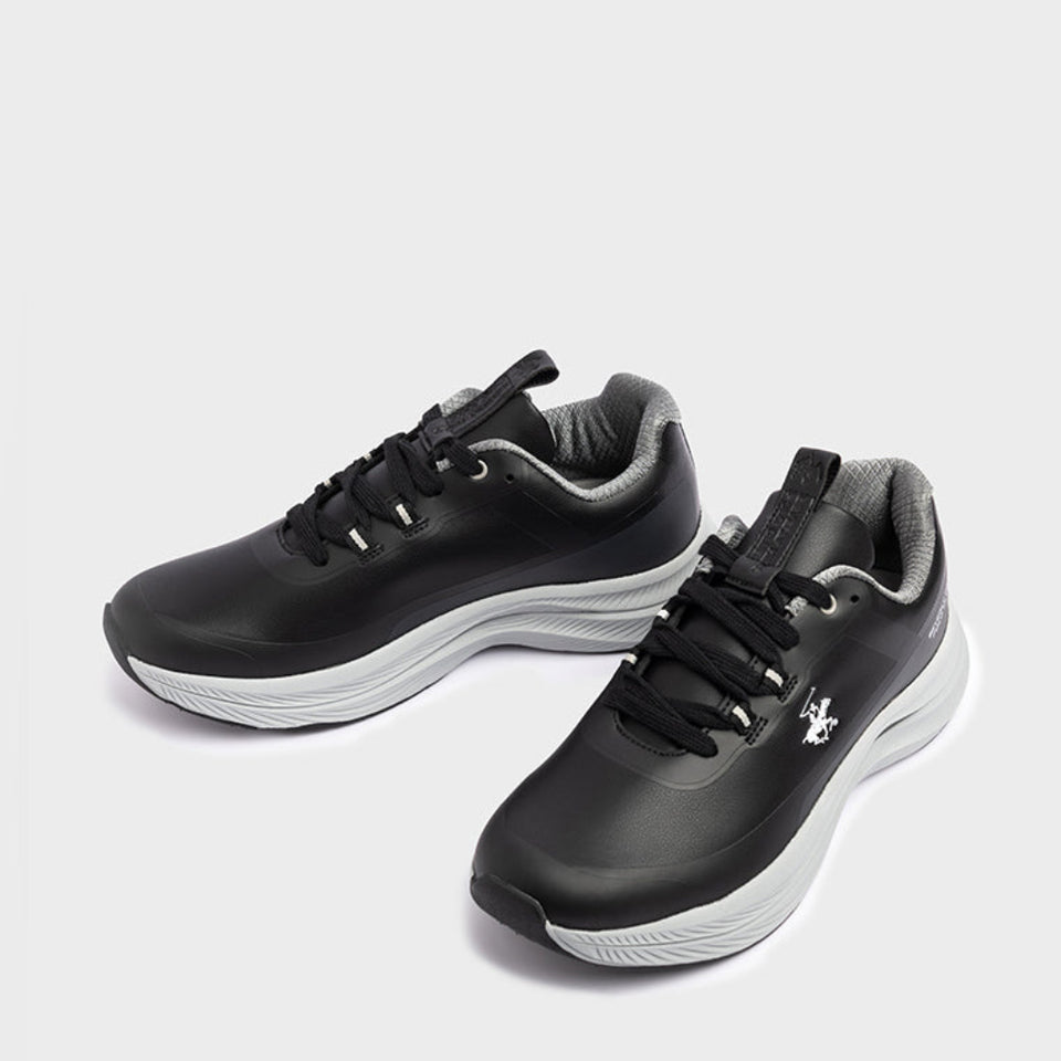 A pair of black athletic sneakers with white midsoles and gray accents, displayed on a light gray background.