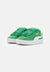 Green sneakers with white soles on a light gray background