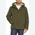 A man wearing an olive green hooded winter jacket with a beige sherpa-lined hood, paired with a white t-shirt and blue jeans, shown against a plain white background.