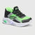 Green and black sneaker with LED lights on a white background
