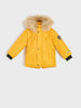 Yellow children's coat with fur hood on a white background