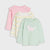 Three children's long-sleeve tops arranged in a stack on a light gray background: a pink top with ruffled shoulders, a white top with pastel yellow and green stripes, and a mint green top with a pink dinosaur graphic.