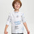 A young boy wearing a light gray heathered long-sleeve t-shirt with blue and black graphic text prints, photographed against a solid light gray background.