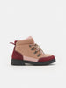Two-tone brown and red boot on a white background