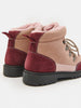 Pair of maroon and beige winter boots with pink fur lining on a white background