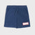 A pair of navy blue sweat shorts with a drawstring waist and a red and white Marvel logo patch on the lower left leg, shown against a light gray background.