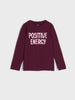 Maroon long-sleeve shirt with 'POSITIVE ENERGY' text on a white background