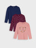 Three long-sleeve shirts in blue, red, and pink on a light gray background