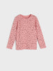Pink long-sleeve shirt with small black patterns on a light gray background