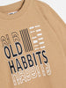 Beige sweatshirt with text design on a white background